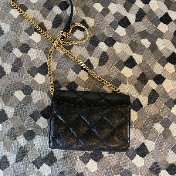Tort Burch quilted black crossbody with gold detail. - Picture 3 of 9